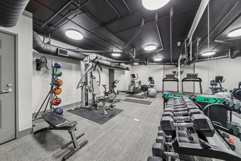 Resident fitness center with cardio equipment at River 595 Apartments