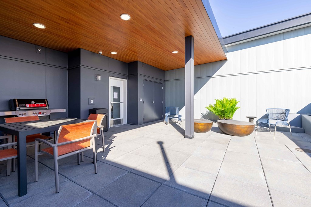 Rooftop decks featuring lounge areas, grilling stations and gorgeous views of the Snohomish River and Cascade Mountain Rangeat Riverfront Everett, Everett, Washington