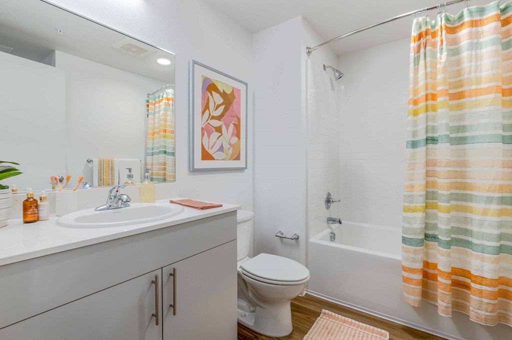 a bathroom with a shower and a toilet and a sinkat Riverfront Everett, Everett