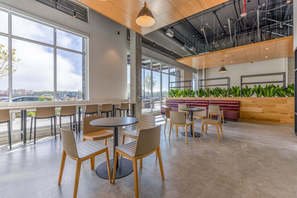 Co-Working Space with chairs, tables and a large window at Riverfront Everett, Everett