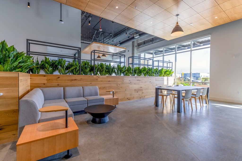 a lounge area with couches and chairs and a table with chairs at Riverfront Everett, Everett, WA, 98101