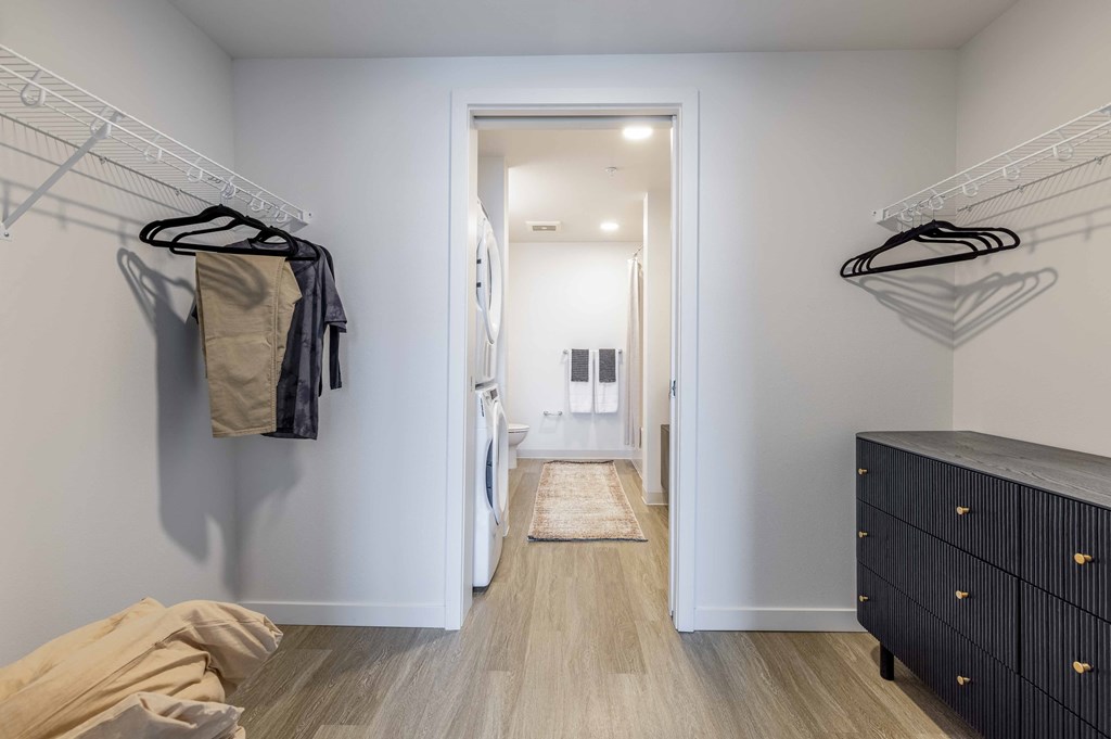 a walk in closet in a 555 waverly unit with closets and clothesat Riverfront Everett, Everett, 98101