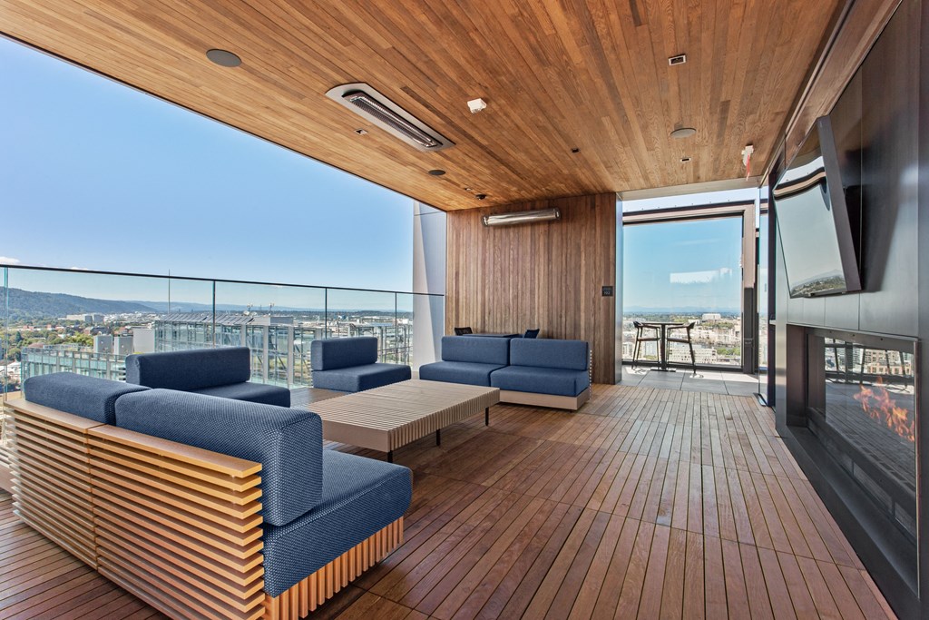 a living area with couches and a coffee table on a wooden floor