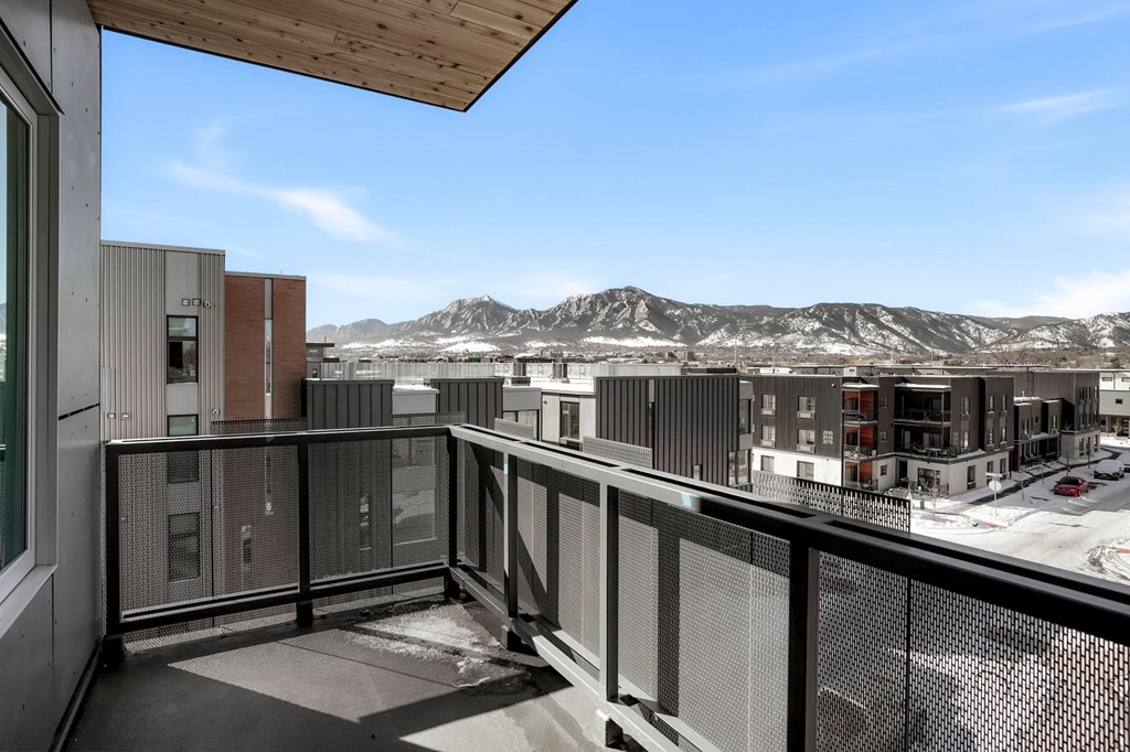 a balcony with a view of a mountain