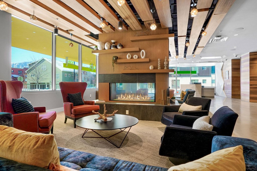 a living room filled with furniture and a fire place