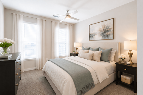 Spacious primary bedroom with natural light and modern finishes inside a Sage 5430 one bedroom apartment in Norcross, Georgia.