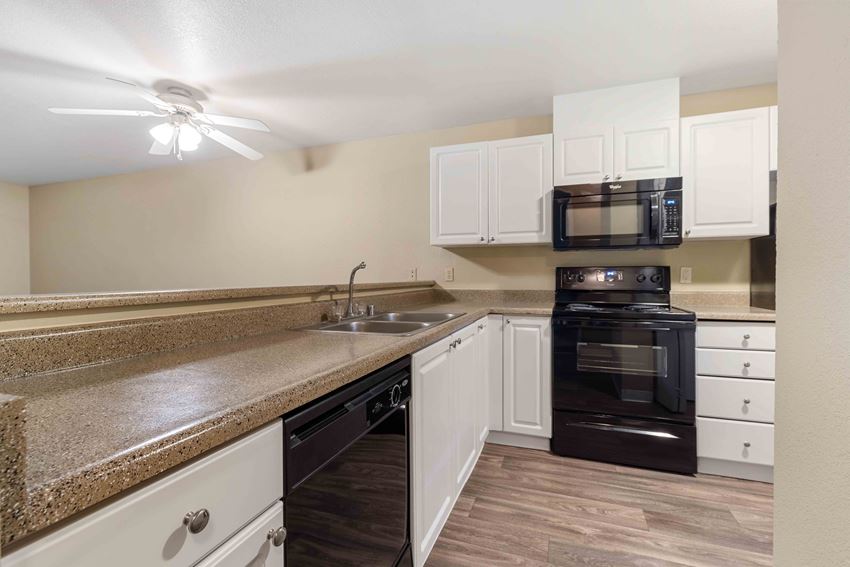 Saratoga Apartments in Everett, WA photo of kitchen with high bar top - Photo Gallery