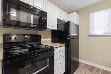 Saratoga Apartments in Everett, WA photo of kitchen with hardwood flooring