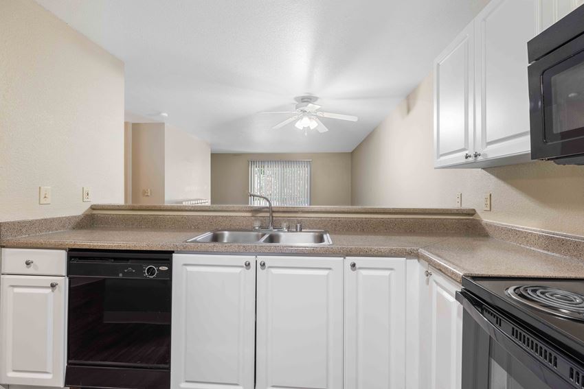 Saratoga Apartments in Everett, WA photo of kitchen with dishwasher - Photo Gallery