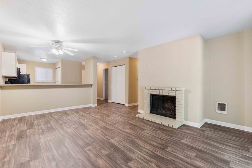 Saratoga Apartments in Everett, WA photo of living room with fireplace - Photo Gallery
