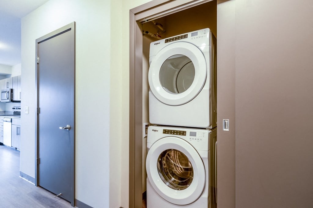 a washing machine and dryer in a laundry room