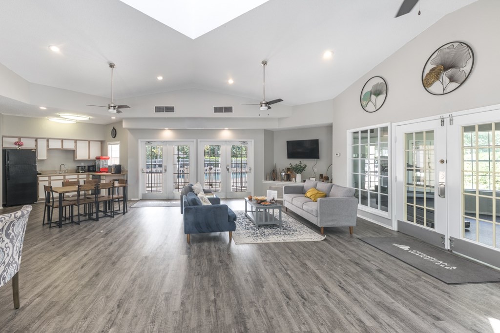 Apartment leasing office with desks and seating at Savannah Sound Apartments Tallahassee