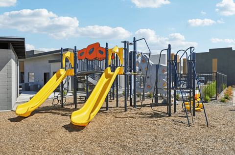 Community playground at Villas at 91st, a gated rental townhome community near Desert Sky Mall in Tolleson, Arizona