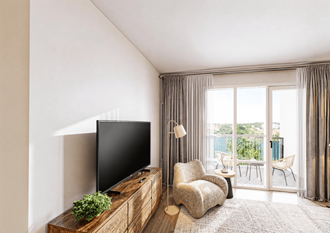 A living room with a television, chair, and table.
