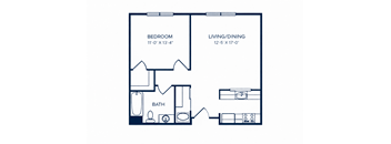 A floor plan of a small apartment with a bedroom, living/dining area, and bathroom.