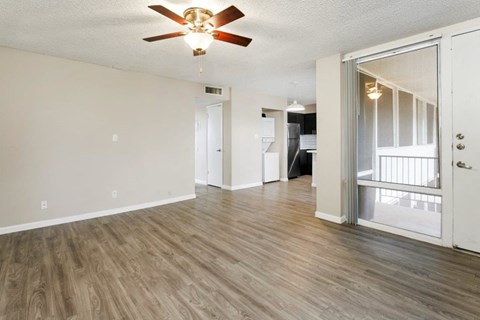 Spacious living room with ceiling fan in a pet-friendly community at Sentry Tempe apartments in Tempe near Mesa, Arizona