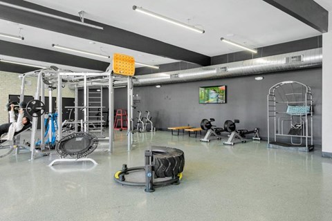 Fully equipped fitness center with modern exercise machines at Sentry Tempe apartments in Tempe near Mesa, Arizona