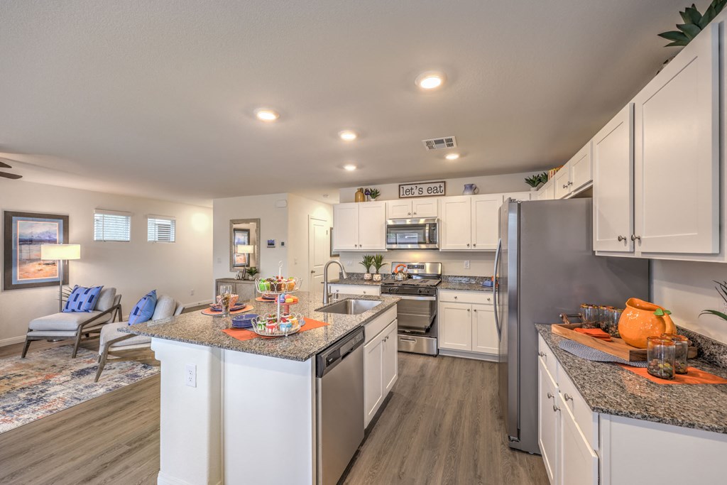 Houses for Rent in Mountain's Edge, NV - Shadow Bay - Chef-Inspired Kitchen with Modern Cabinetry, Stainless Steel Appliances, and Vinyl Plank Flooring.