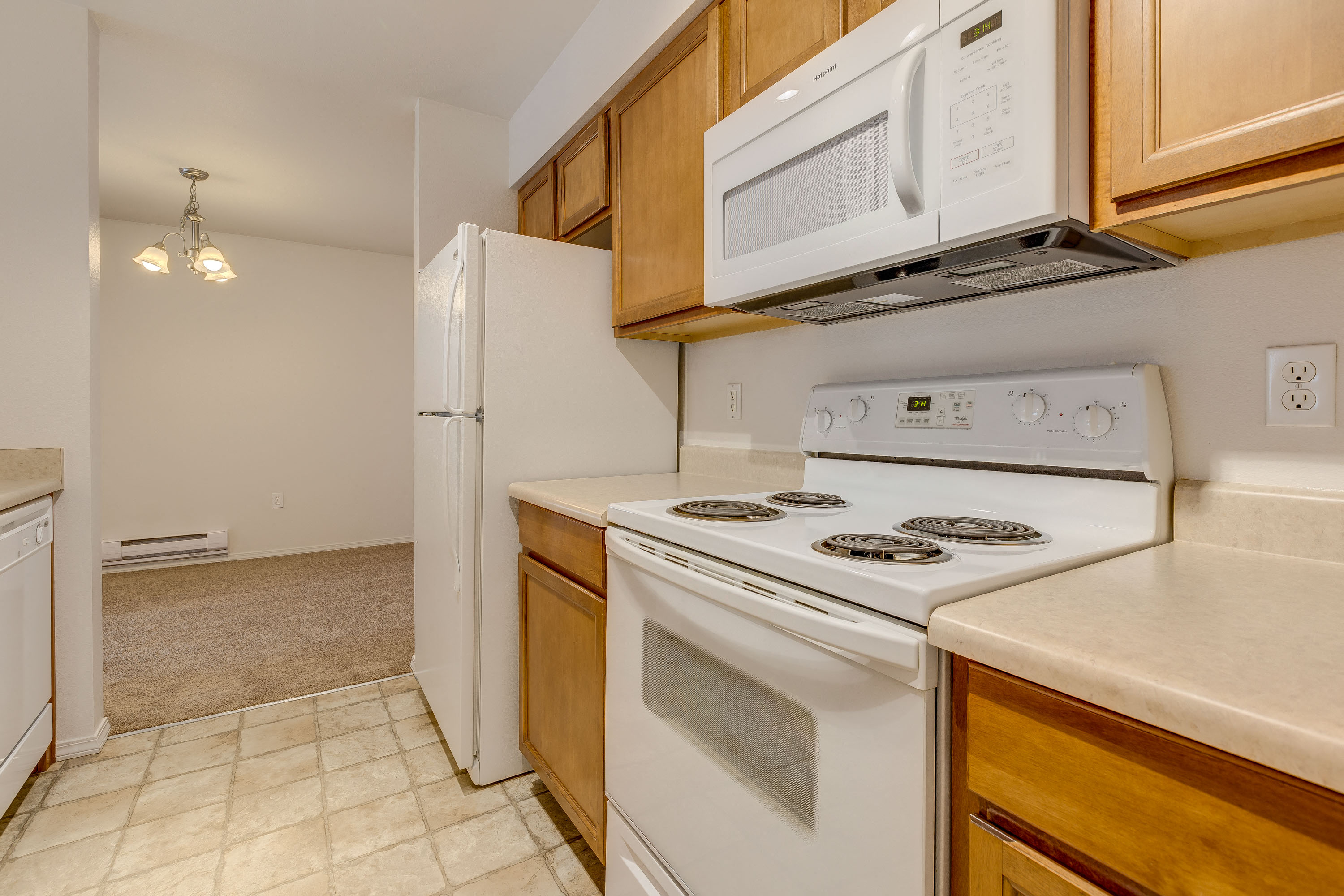 a kitchen with a stove microwave and refrigerator