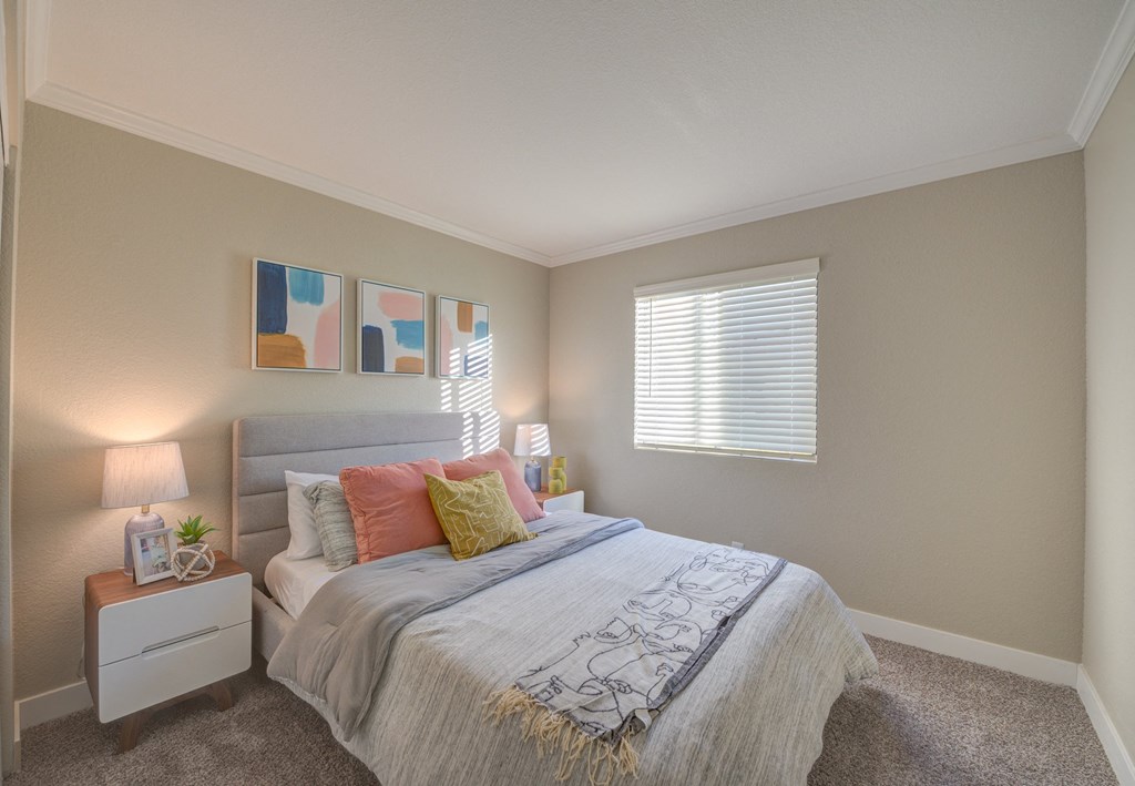 Two Bedroom Apartments in Moreno Valley CA - Ardella on Chagall - Bedroom with Bed, Nightstands, Lamps, Wall Decor, and Window