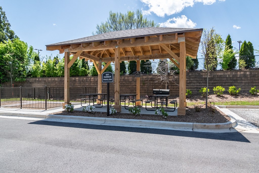 Sky Harbor Apartments in Chamblee, GA photo of a pavilion with a grill and picnic tables