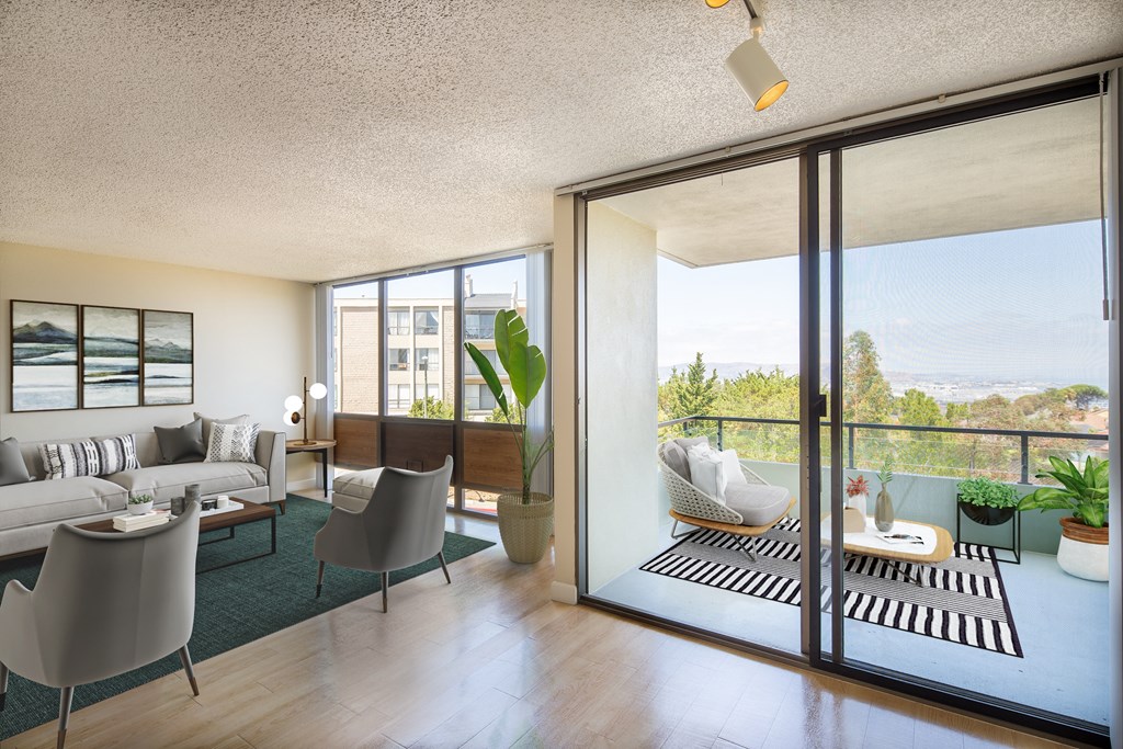 a living room with sliding glass doors and a balcony