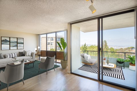 a living room with sliding glass doors and a balcony