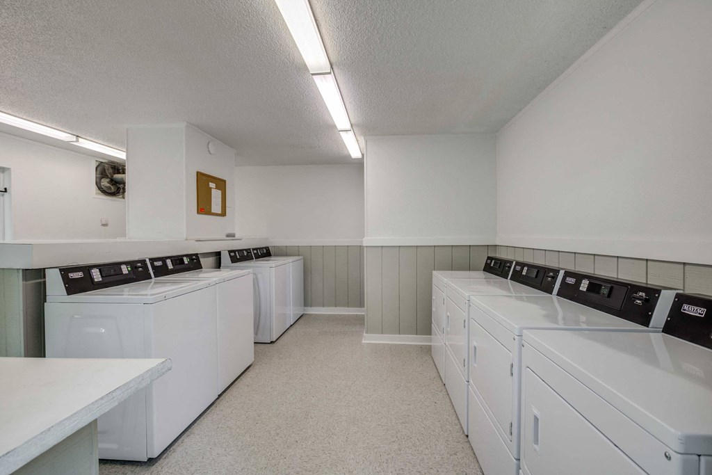 Laundry lounge at Somerset Apartments, a pet-friendly community in Charlotte near Huntersville, NC, offering convenient on-site laundry facilities in a comfortable setting.