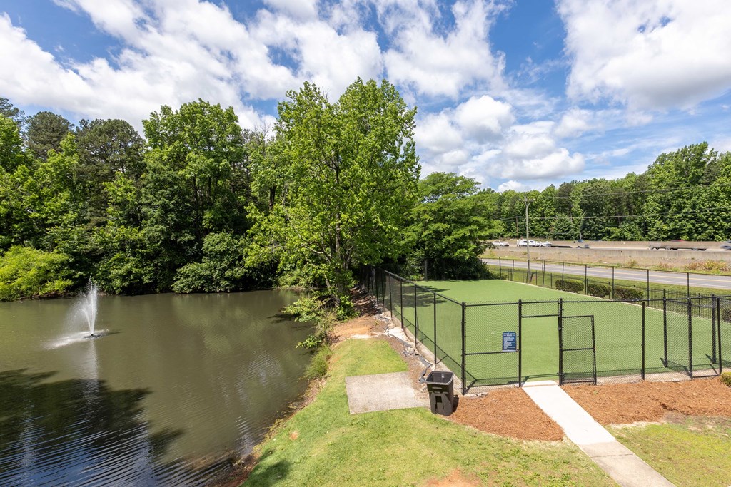 Fenced pet park at Somerset Apartments, a pet-friendly community in Charlotte near Huntersville, NC, providing a safe and fun space for dogs to play off-leash.