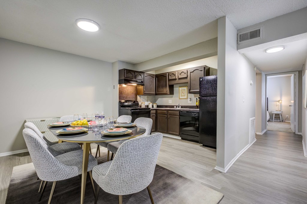 Spacious kitchen and dining area at Somerset Apartments, a pet-friendly community in Charlotte near Huntersville, NC, featuring modern appliances and an open-concept layout.