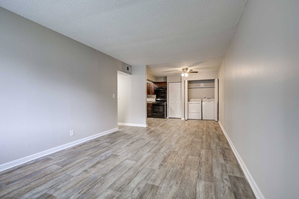 Large and open living room at Somerset Apartments, a pet-friendly community near Charlotte and Huntersville, NC, featuring an in-unit washer and dryer.