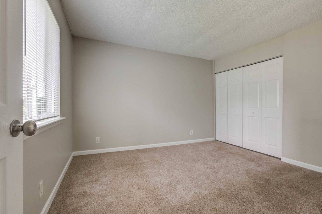 Somerset Apartments in Charlotte, NC photo of a bedroom with a closet and a window