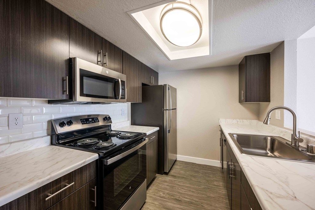 modern kitchen with stainless steel appliances in a home