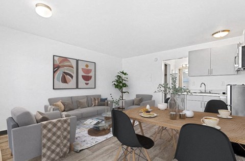 a living room and dining room with a table and chairs