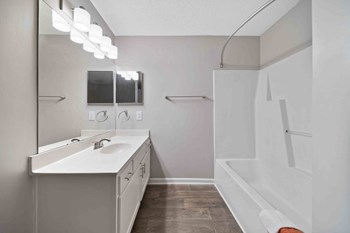 Updated bathroom with large shower and white cabinetry - Photo Gallery 6