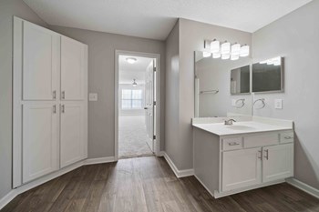 large bathroom with expansive mirror. - Photo Gallery 5