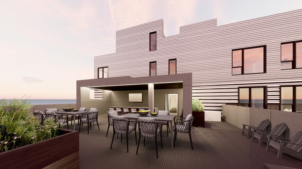 Open roof deck with tables and chairs