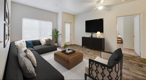 A living room with a black couch, a brown coffee table, and a television on a black stand.