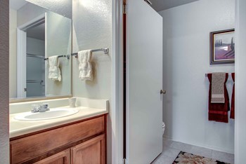 Manteca CA Apartments for Rent - Stonegate Apartments Bathroom with a Vanity, Stainless Steel Fixtures, and Shower