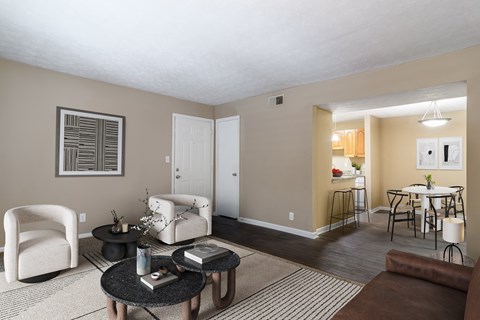 Spacious living room with natural light and comfortable seating in a pet-friendly home at Stratford Ridge Apartments in Marietta, GA.