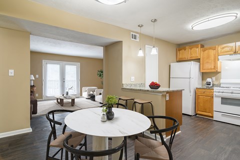 Dining room at Stratford Ridge Apartments near Smyrna, GA, featuring ample space for meals and gatherings with natural lighting and modern fixtures.