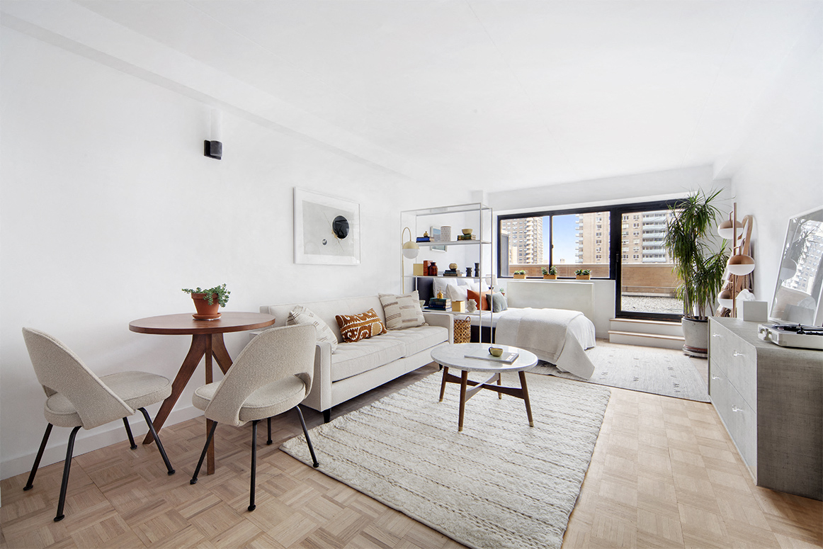 a living room with a couch and a table