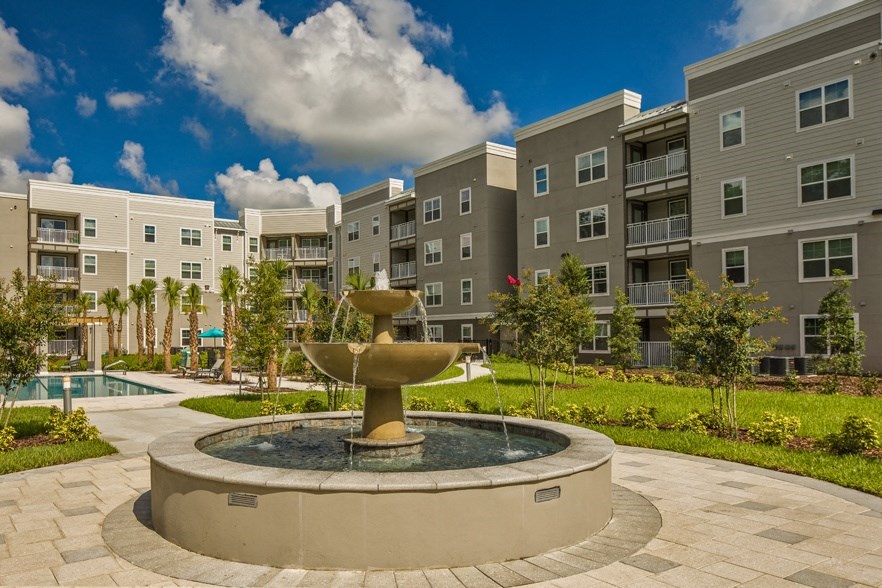 Summerset Apartments in Zephyrhills, FL photo of fountain and exterior of buildings