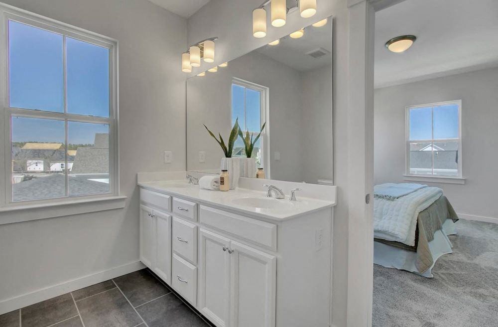 Houses For Rent In North Charleston, SC - Sumner Village - Bathroom With Double Sink, Large Window, And Tile Flooring With Access To Bedroom