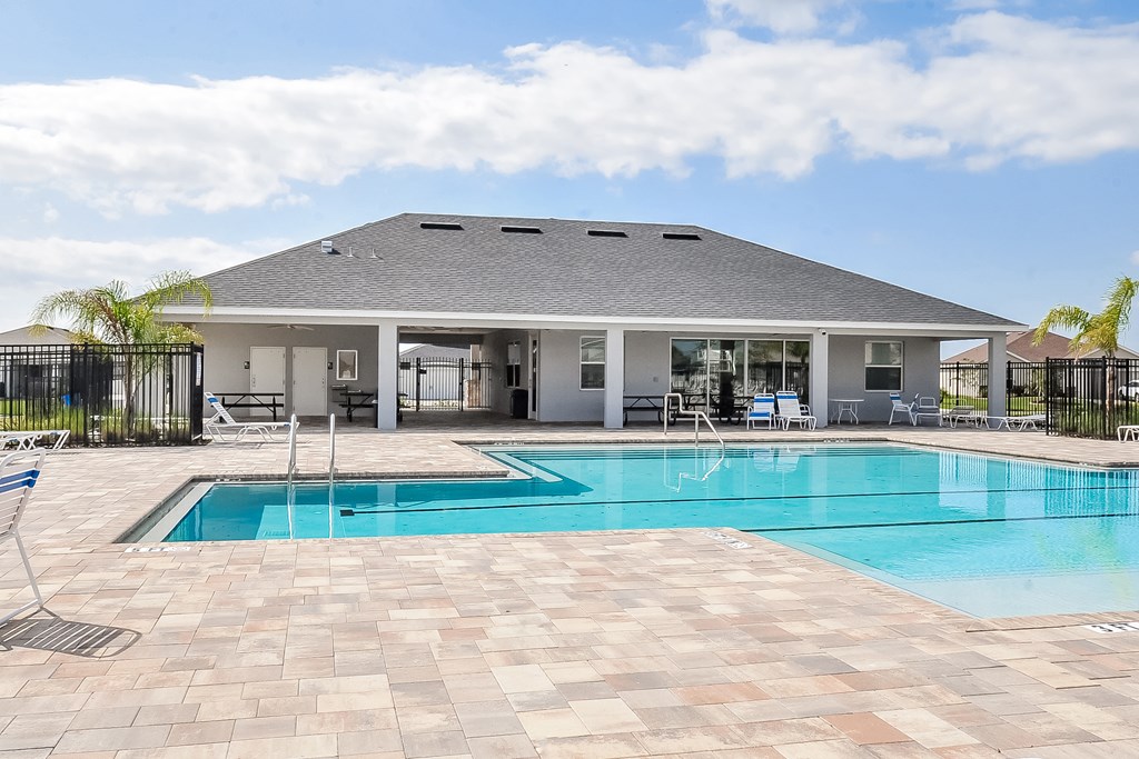 A house with a pool in the backyard.