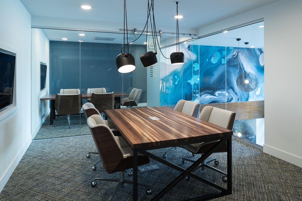 a conference room with a table and chairs
