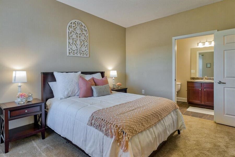 Pet-Friendly Apartments in Oakridge, TN - Centennial Village - Bedroom with Attached Bathroom