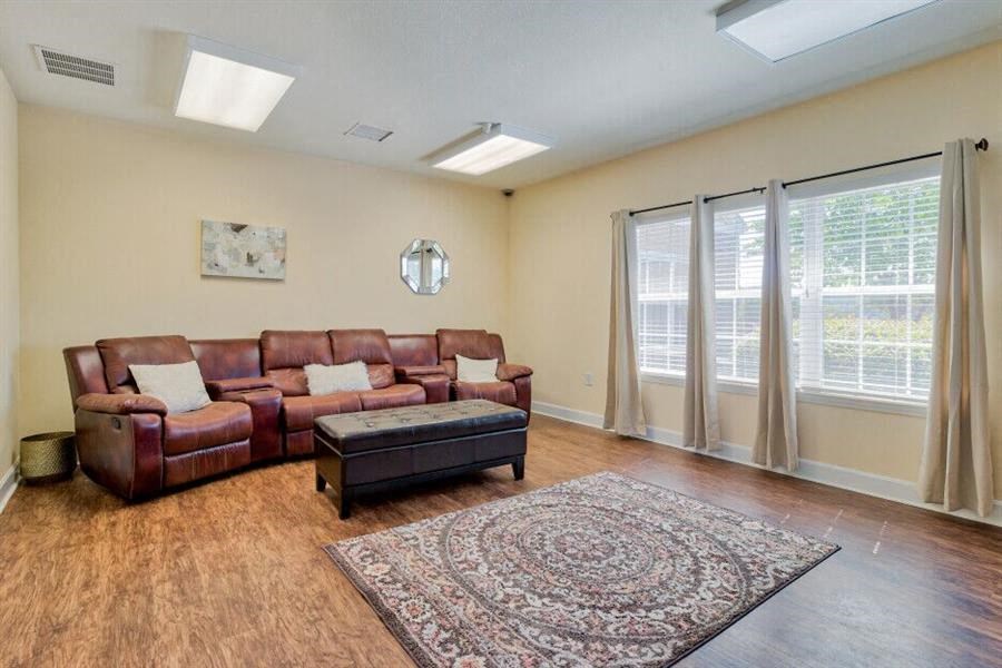 Oakridge, TN Apartments - Centennial Village - Clubhouse With Couches and Large Windows