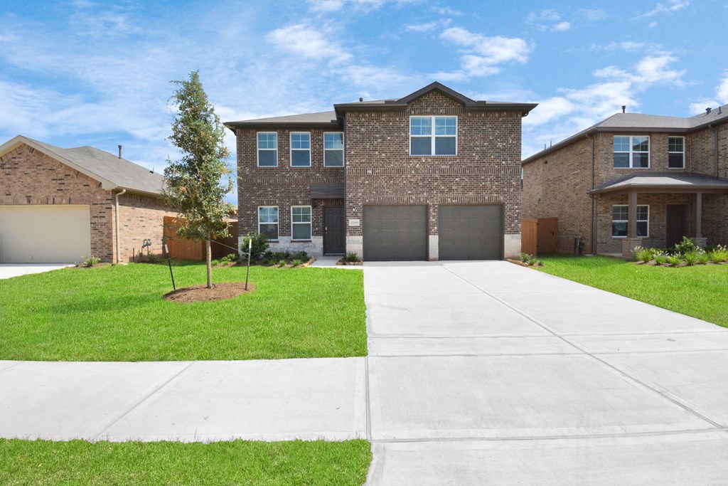a house with a long driveway in front of it