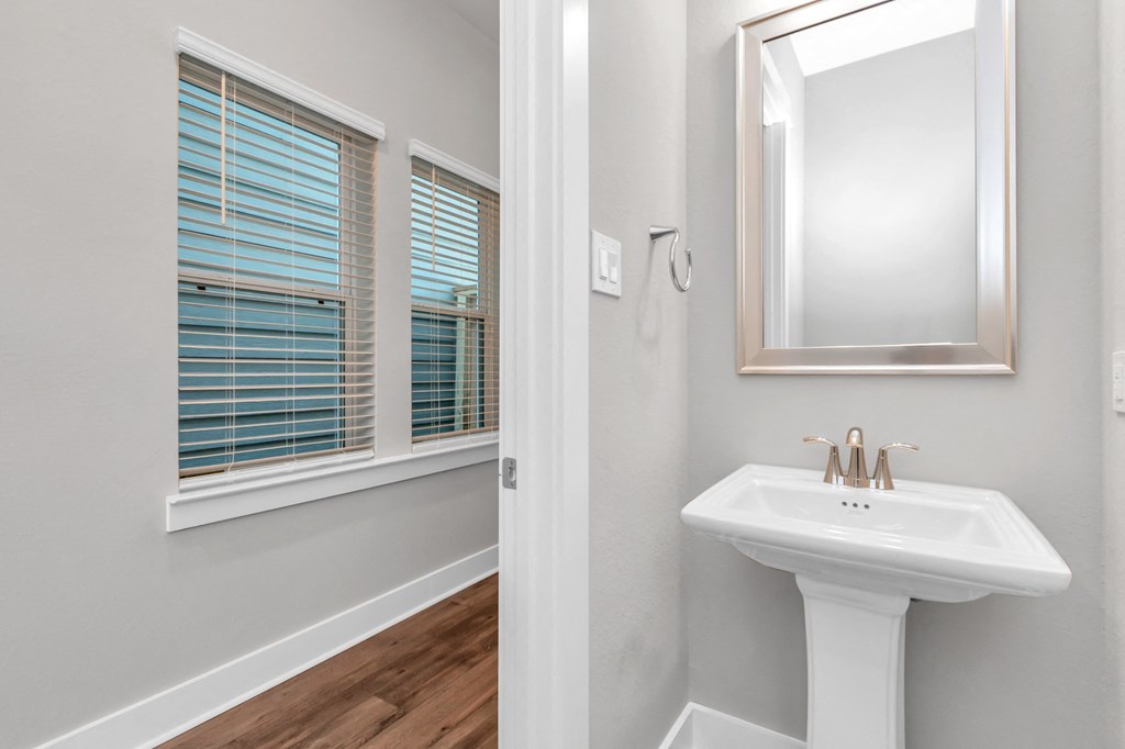 a bathroom with a sink and mirror